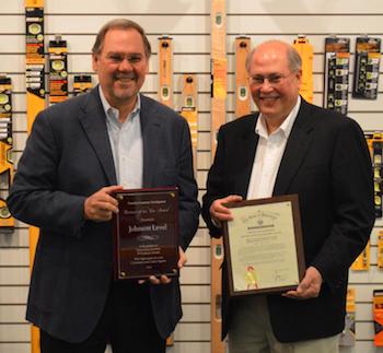 Brothers Bob Johnson (L), CEO of Johnson Level and Bill Johnson (R), President of Johnson Level proudly display the company's Mid-Size Business of the Year award. 
