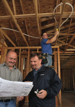 Plumbing contractor Steve Svedarsky (left) credits Uponor rep Kelly Fahey (right) with helping him to complete 20 fire sprinkler jobs and to secure an  additional 30 multi-family units &mdash; all in less than four months in 2007.