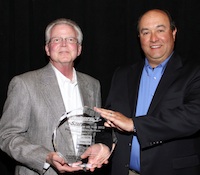 Simpson Strong-Tie's Kent Gilbert & Mike Clemente accept the Sphere 1 Vendor Partner of the Year award for 2012.. Simpson Strong-Tie's Kent Gilbert & Mike Clemente accept the Sphere 1 Vendor Partner of the Year award for 2012..