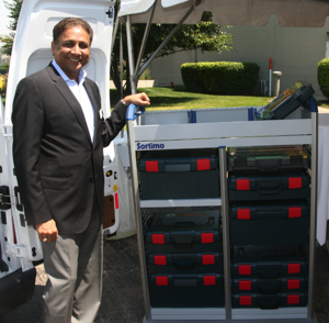 Mahendra Srivastava, president of Sortimo North America demonstrates the new storage and transportation system designed around Bosch Click & Go tool boxes.  