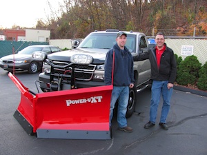 Full-time firefighter and part-time snow removal contractor, Connor Hedge, 24, of Westfield, Mass., is the proud owner of a new Power-V XT Snowplow, one of two Grand Prizes in the Heavy Metal Sweepstakes sponsored by THE BOSS Snowplow and Gravely in September. Here Connor (L) picks up his new Boss snowplow from Kenneth Cashman, owner of BOSS distributor Ken’s Auto Sales, 921 Main St., Holyoke, Mass.